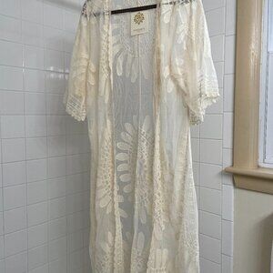 Cream colored lace coverup by Rebellion, size small